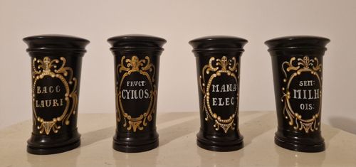 Four ebonized wooden apothecary jars, early 19th century